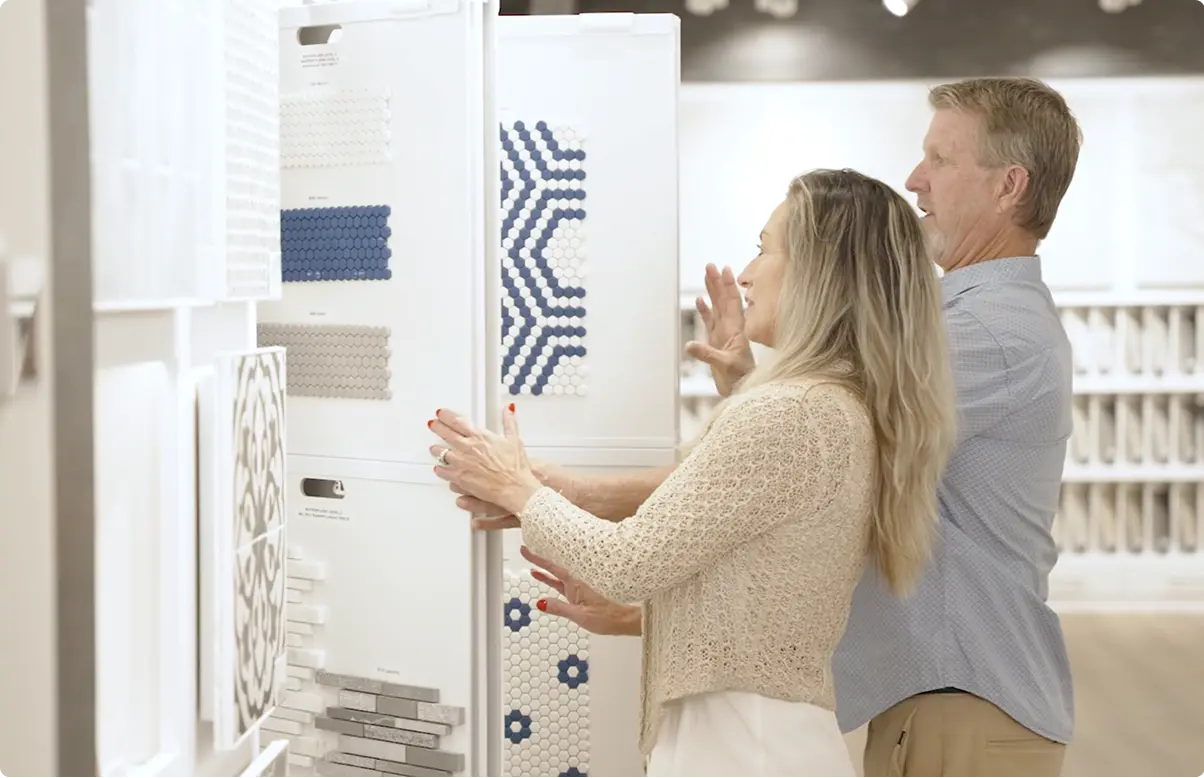 Couple choosing custom tiles for their new home