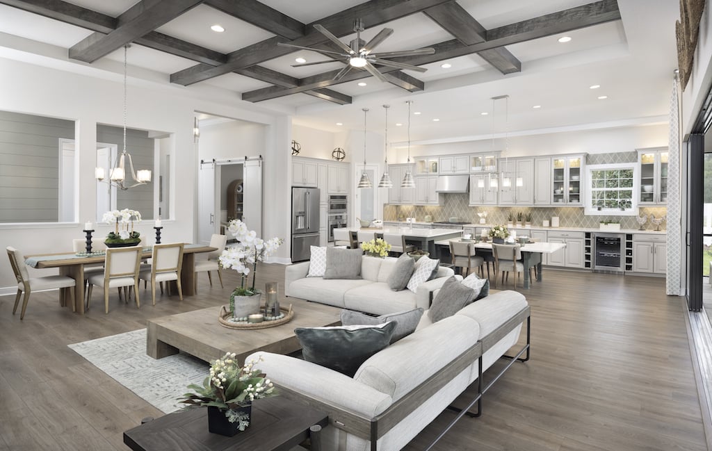 Interior living area with exposed ceiling, sofa living area, dinign table, and open-concept kitchen