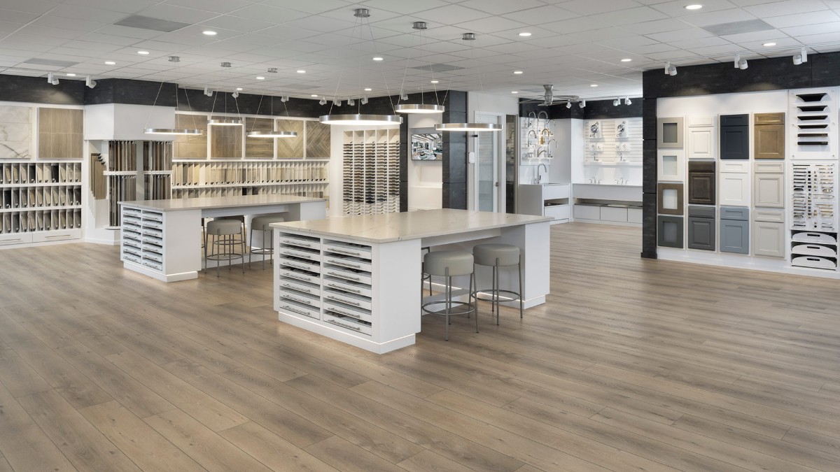 WestBay home living area and kitchen interior model displaying an island and pendant lighting